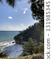 A small secluded lagoon among the rocks and a turbulent stormy sea Turkey Antalya 131985345
