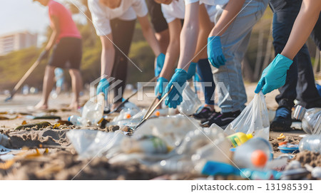 World Environment Day, A group of people picking up litter on a beach showcase 131985391