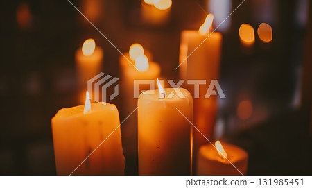Pentecost, A quiet chapel interior where candles are softly glowing 131985451