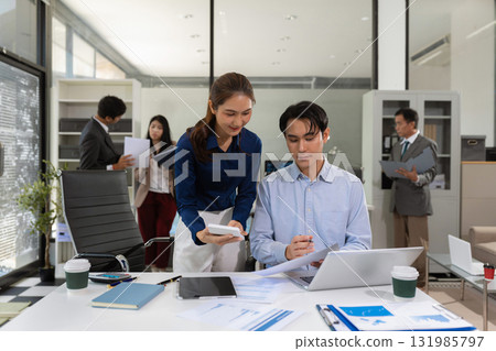 Asian business team collaboration, office project review or strategy meeting. 131985797