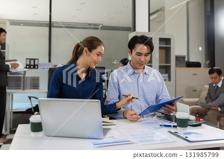 Asian business team collaboration, office project review or strategy meeting. 131985799