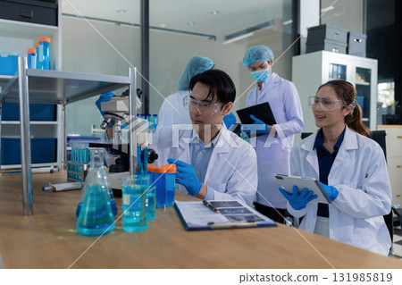 Glass vial, pipette and scientist in laboratory for medical study, research or experiment. 131985819
