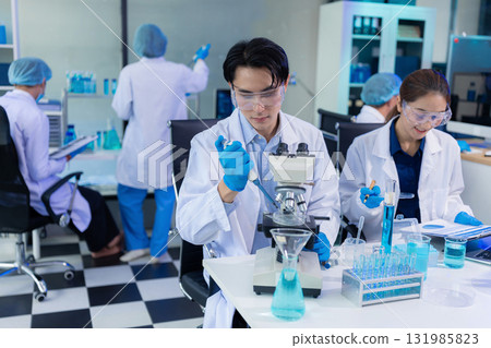 Glass vial, pipette and scientist in laboratory for medical study, research or experiment. 131985823
