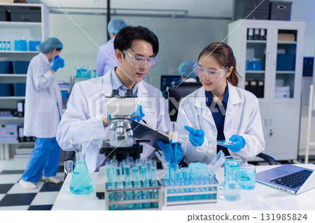 Glass vial, pipette and scientist in laboratory for medical study, research or experiment. 131985824