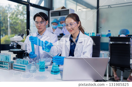 Glass vial, pipette and scientist in laboratory for medical study, research or experiment. 131985825