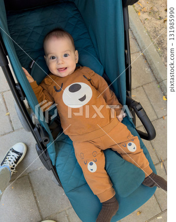 Baby in Stroller with Bear-Themed Outfit Baby in Stroller with Bear-Themed Outfit 131985990