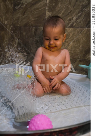 Curious Baby Playing in Shower 131986038