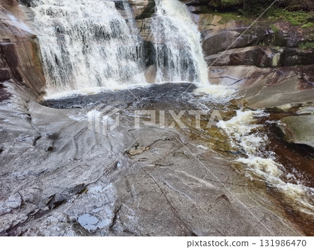 Breathtaking Waterfall Cascading Gracefully Over the Rocky Terrain of Natures Splendor Breathtaking Waterfall Cascading Gracefully Over the Rocky Terrain of Natures Splendor 131986470