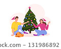Man and woman decorate Christmas tree. Happy Family celebrating New Year at home together with holiday decorations 131986892