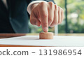 Close up on hand of businessman choosing and picking a piece of blank wooden cube block for success in business 131986954