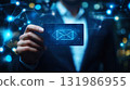 Businessman touching holographic Email Icon and  representing online messaging and connection glowing envelope in technology 131986955