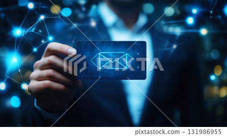 Businessman touching holographic Email Icon and  representing online messaging and connection glowing envelope in technology Businessman touching holographic Email Icon and  representing online messaging and connection glowing envelope in technology 131986955