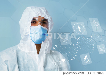 Healthcare professional in protective gear with health icons in the background Healthcare professional in protective gear with health icons in the background 131987068