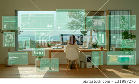 一位女士在自家辦公室的電腦上進行未來數據分析，同時欣賞海景 131987276