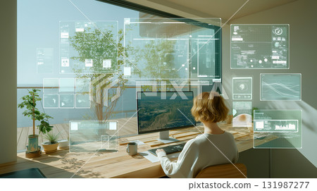 一位女士在自家辦公室的電腦上進行未來數據分析,同時欣賞海景 一位女士在自家辦公室的電腦上進行未來數據分析,同時欣賞海景 131987277