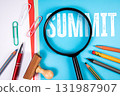 Summit concept with magnifying glass over word summit on blue background surrounded by office 131987907