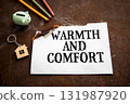 Warmth and comfort concept with burning paper showing text warmth and comfort 131987920