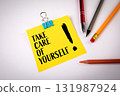 Take care of yourself concept with yellow note paper and stationery on desk. Symbol of health 131987924