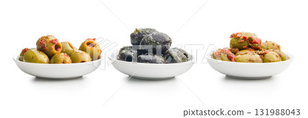 Tapas. Flavored pickled olives in bowl isolated on white background. 131988043