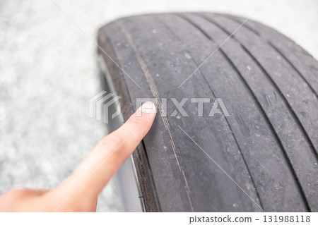 Tire with wire sticking out (pointing) 131988118