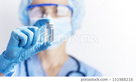 Healthcare Professional Holding a Vaccine Vial 131988218