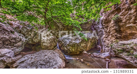 Waterfall and rocks in Richtis Gorge Crete Greece 131989331