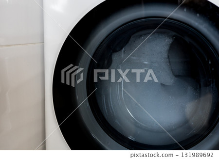 Close-up modern washing machine with foam Close-up modern washing machine with foam 131989692