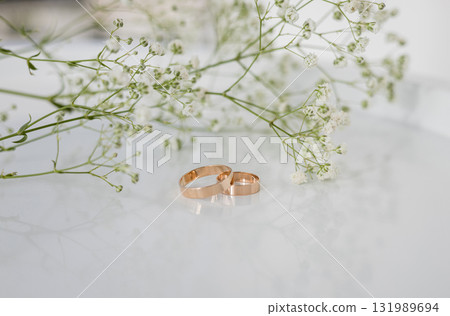 Two elegant gold wedding rings Two elegant gold wedding rings 131989694
