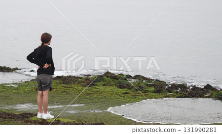 Young woman on the beach Young woman on the beach 131990281