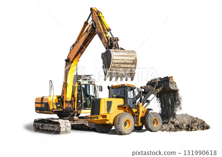 Heavy machinery working together to move earth and dig at construction site Heavy machinery working together to move earth and dig at construction site 131990618