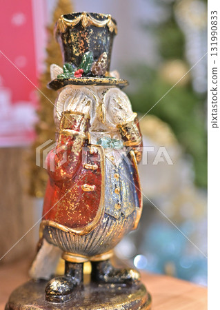 Stylish owl Christmas ornaments | Seasonal ornaments with a tree background Stylish owl Christmas ornaments | Seasonal ornaments with a tree background 131990833