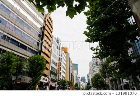 Looking towards Shibuya Station from Shibuya Fire Street, clear blue summer sky, Shibuya Ward, Tokyo 131991070
