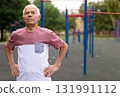 Portrait of sporty grandfather on playground in summer park 131991112