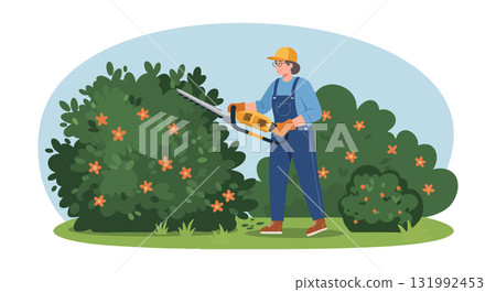 Gardener trimming green bushes with orange flowers using electric hedge trimmer outdoors 131992453