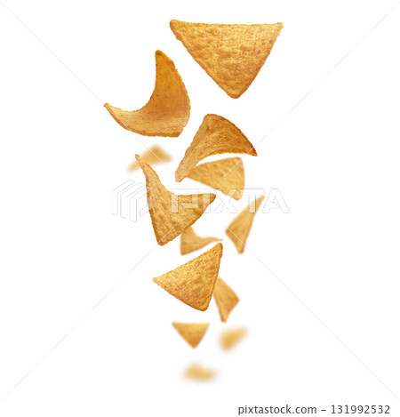 Corn chips of triangular shape levitate on a white background Corn chips of triangular shape levitate on a white background 131992532