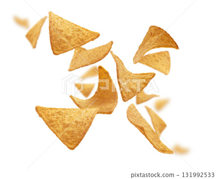 Corn chips of triangular shape levitate on a white background Corn chips of triangular shape levitate on a white background 131992533