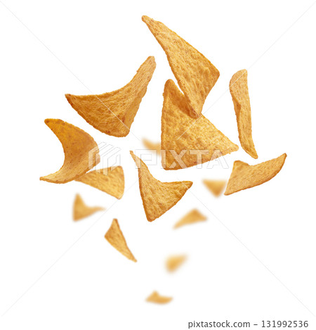 Corn chips of triangular shape levitate on a white background Corn chips of triangular shape levitate on a white background 131992536