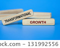 Wooden blocks showing TRANSFORMATIONAL GROWTH text for innovation and change 131992556