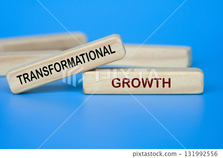 Wooden blocks showing TRANSFORMATIONAL GROWTH text for innovation and change 131992556