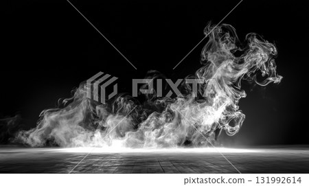 A ray of light and rising white smoke illuminate the dark stage. 131992614