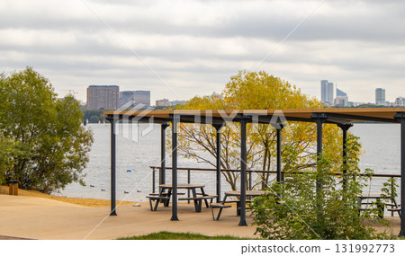 Stroginsky Bay view with waterfront pergola and picnic tables autumn day Moscow 131992773