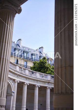 Classical columns and Parisian architecture with rooftop greenery Classical columns and Parisian architecture with rooftop greenery 131992871