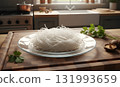 Raw clear vermicelli noodles arranged neatly on a glass plate, accompanied by fresh cilantro and mushrooms on a wooden cutting board, ideal for simple Asian food preparation. AI Generated 131993659