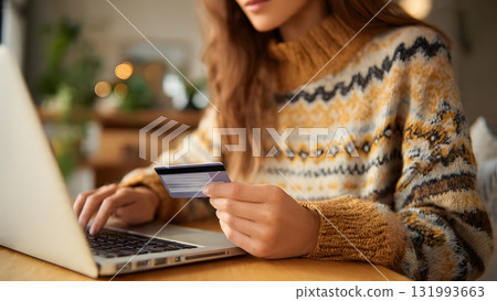 A focused woman enters credit card details on a laptop for secure online payment, symbolizing fast e-commerce and convenient digital banking. AI Generated 131993663