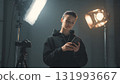 A young female content creator films a promotional video using a smartphone on a tripod, symbolizing digital marketing, social media influence, and modern entrepreneurship. AI Generated 131993667