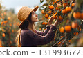 A smiling woman farmer stands proudly beneath her persimmon tree, representing a successful, bountiful autumn harvest and organic farming success. AI Generated 131993672