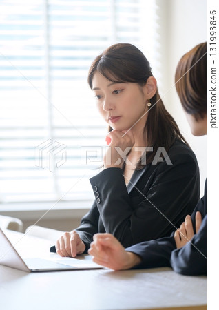 Business woman troubled watching a personal computer Business woman troubled watching a personal computer 131993846