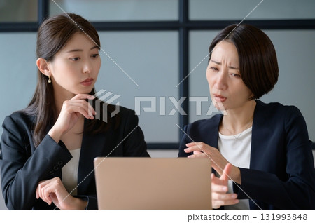 Business woman troubled watching a personal computer 131993848