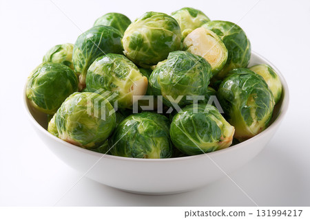 Fresh Brussels sprouts in a white bowl ready for cooking or serving 131994217