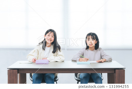 Two girls studying in the room 131994255